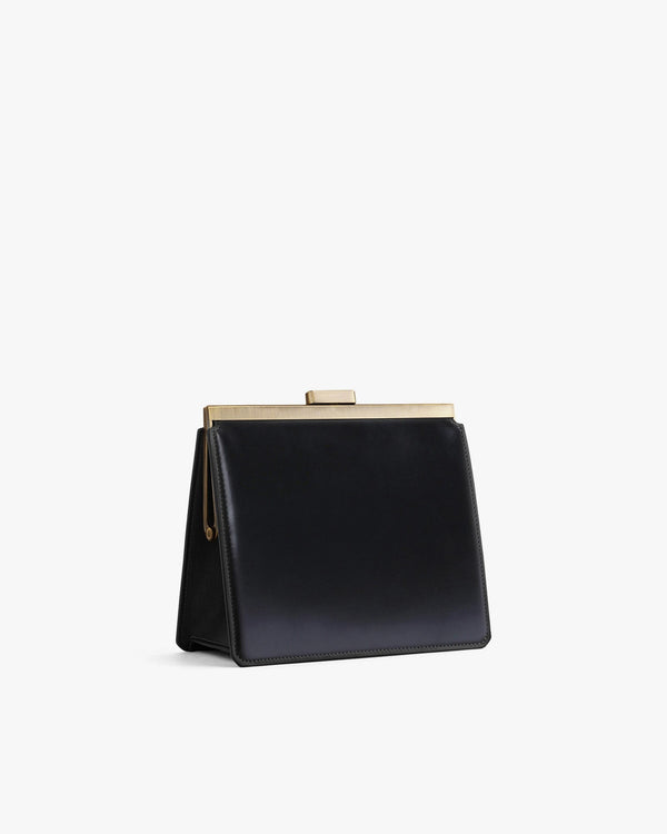 Sac JEANNE noir, vue de profil, fermoir métallique doré, posé sans bandoulière
